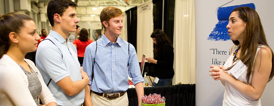 Career Education Center, Career Fair, Career Expo, Students interacting with, talking with, to, talks, interacts, speaks, potential employers